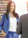 Happy laughing young businesswoman sharing a joke with a male co Royalty Free Stock Photo