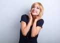 Happy laughing young woman with blond hair style looking up on b Royalty Free Stock Photo