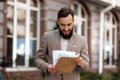 Happy lawyer reads the mailing notice. Winning in court. Positive verdict