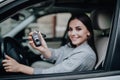 Happy learner driver young woman smiling portrait with car keys Royalty Free Stock Photo