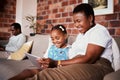 Happy, learning and a mother with a tablet and a child for a cartoon, movies or games on the sofa. Smile, reading and an
