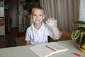 Left-handed boy put his left hand in plastic glove to avoid messy, international left-hander day