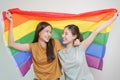 Happy lesbian, beautiful asian young two women, girl gay, couple love moment spending good time together, holding or waving lgbt Royalty Free Stock Photo
