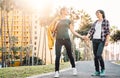 Happy lesbian couple having fun dating outdoor - Young gay women walking and holding hands outside Royalty Free Stock Photo