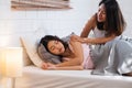Happy lesbian couple wake up on bed in bedroom in morning and hug each other at home.LGBTQ lifestyle concept Royalty Free Stock Photo