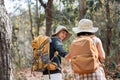 Happy LGBT Lesbian couple Travelers Hiking with Backpacks in forest Trail. LGBT Lesbian Couple Hikers with backpacks Royalty Free Stock Photo