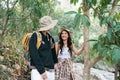 Happy LGBT Lesbian couple Travelers Hiking with Backpacks in forest Trail. LGBT Lesbian Couple Hikers with backpacks Royalty Free Stock Photo