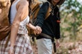 Happy LGBT Lesbian couple Travelers Hiking with Backpacks in forest Trail. LGBT Lesbian Couple Hikers with backpacks Royalty Free Stock Photo