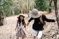 Happy LGBT Lesbian couple Travelers Hiking with Backpacks in forest Trail. LGBT Lesbian Couple Hikers with backpacks Royalty Free Stock Photo