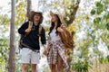 Happy LGBT Lesbian couple Travelers Hiking with Backpacks in forest Trail. LGBT Lesbian Couple Hikers with backpacks Royalty Free Stock Photo