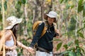 Happy LGBT Lesbian couple Travelers Hiking with Backpacks in forest Trail. LGBT Lesbian Couple Hikers with backpacks Royalty Free Stock Photo