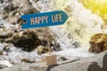 Happy life sign board on rock Royalty Free Stock Photo