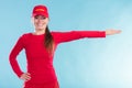 Happy lifeguard woman in cap pointing direction. Royalty Free Stock Photo