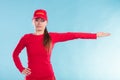 Happy lifeguard woman in cap pointing direction. Royalty Free Stock Photo