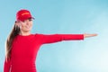 Happy lifeguard woman in cap pointing direction. Royalty Free Stock Photo