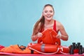 Happy lifeguard woman lying on rescue ring buoy. Royalty Free Stock Photo
