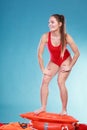 Happy lifeguard woman on rescue ring buoy. Royalty Free Stock Photo