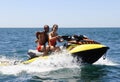 Happy Lifeguards Couple on a Water Scooter Royalty Free Stock Photo