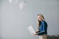 Happy light-haired woman with a laptop