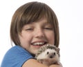 Happy litle girl with African pygmy hedgehog Royalty Free Stock Photo