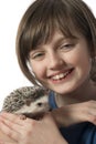 Happy litle girl with African pygmy hedgehog Royalty Free Stock Photo