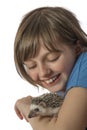 Happy litle girl with African pygmy hedgehog Royalty Free Stock Photo