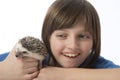 Happy litle girl with her pet African pygmy hedgehog Royalty Free Stock Photo