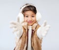 Happy littl girl in winter clothes