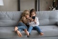 Happy little adorable kids playing games on cellphone. Royalty Free Stock Photo