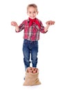 Happy little agriculturist showing potato harvest Royalty Free Stock Photo