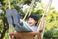 Happy little child laughing and swinging on a swing Royalty Free Stock Photo