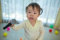 Happy little asian girl with microphone Royalty Free Stock Photo