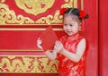 Happy little Asian girl received a red envelope. Chinese New Year celebration Royalty Free Stock Photo