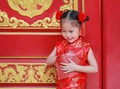 Happy little Asian girl received a red envelope. Chinese New Year celebration Royalty Free Stock Photo