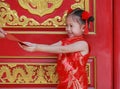 Happy little Asian girl received a red envelope. Chinese New Year celebration Royalty Free Stock Photo