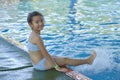 Happy Little Asian Girl At The Pool Royalty Free Stock Photo