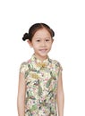 Happy little Asian girl wearing cheongsam with smiling over white background. Happy Chinese New Year Royalty Free Stock Photo