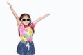 Happy little Asian kid girl stretch arms wide open wearing a floral pattern summer dress and sunglasses isolated on white Royalty Free Stock Photo