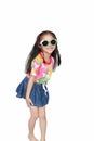 Happy little Asian kid girl wearing a flowers summer dress and sunglasses isolated on white background. Summer fashion kid concept Royalty Free Stock Photo