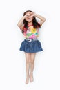 Happy little Asian kid girl wearing a flowers summer dress and sunglasses isolated on white background. Summer fashion kid concept Royalty Free Stock Photo