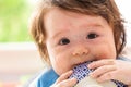 Happy little baby boy eating food Royalty Free Stock Photo