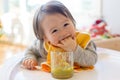 Happy little baby boy eating food Royalty Free Stock Photo