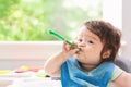Happy little baby boy eating food Royalty Free Stock Photo