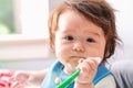 Happy little baby boy eating food Royalty Free Stock Photo