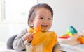 Happy little baby boy eating food Royalty Free Stock Photo