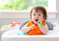 Happy little baby boy eating food Royalty Free Stock Photo