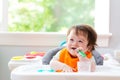 Happy little baby boy eating food Royalty Free Stock Photo