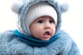 Happy little baby boy making outdoors in winter. Cute toddler in winter cloth. Child having fun on cold day. Winter walk Royalty Free Stock Photo