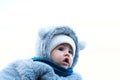 Happy little baby boy making outdoors in winter. Cute toddler in winter cloth. Child having fun on cold day. Winter walk Royalty Free Stock Photo