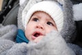 Happy little baby boy making outdoors in winter. Cute toddler in winter cloth. Child having fun on cold day. Winter walk Royalty Free Stock Photo